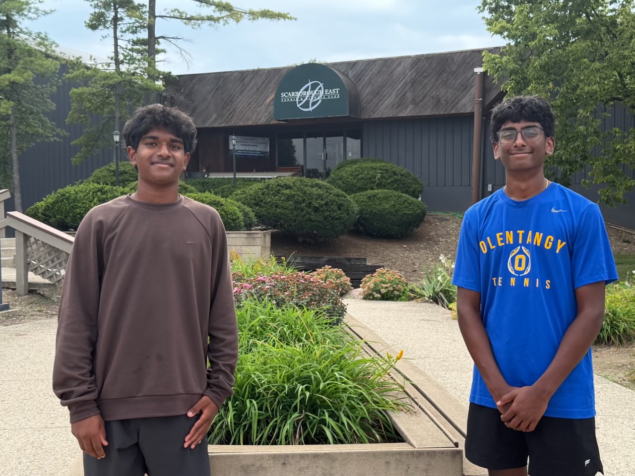 Prathik Amathi and Jashwin Pisini standing outside the Scarborough East Tennis and Fitness Club building